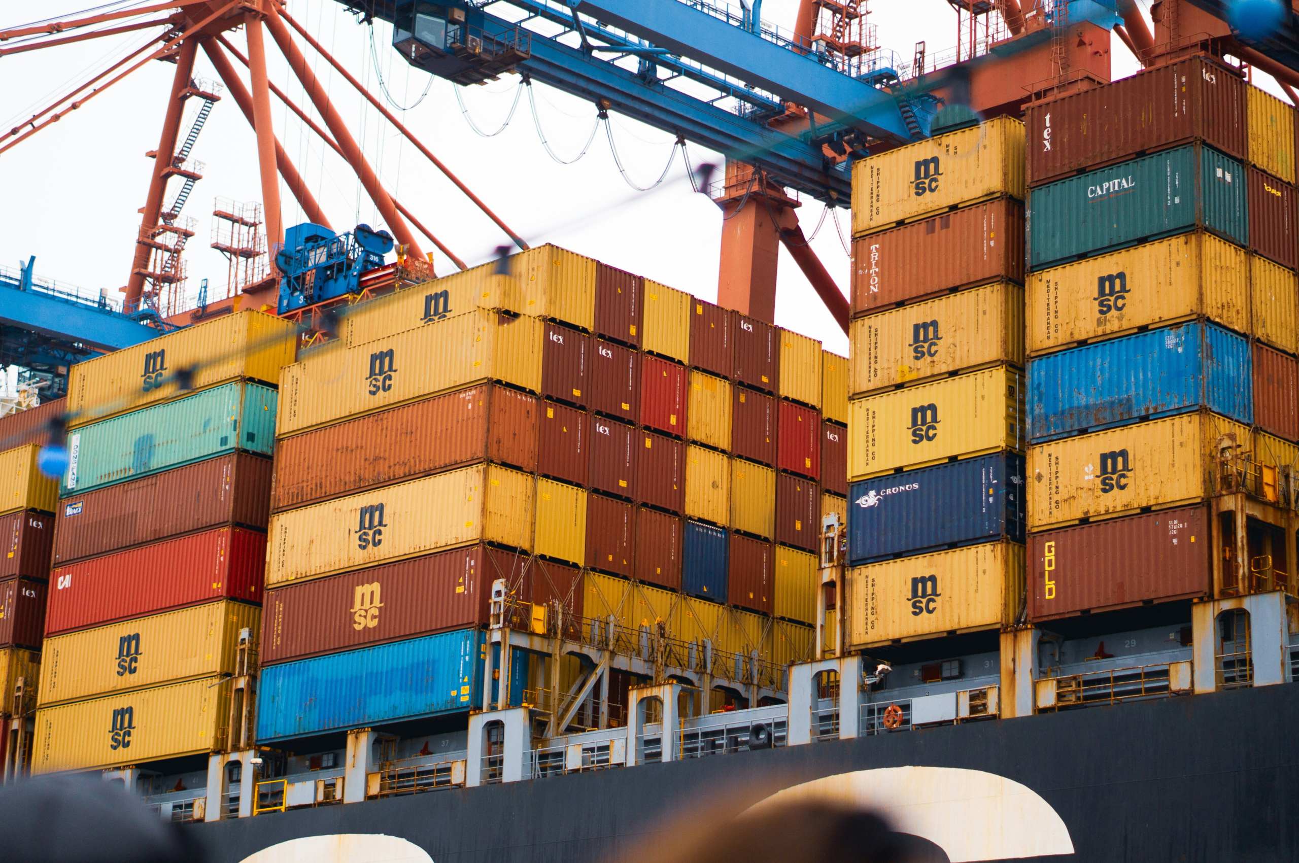 Cargo containers on ship – mainly yellow
